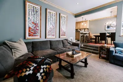a living room with a couch and a table at BEST Location . Walk To Canyon Lodge . Views . Pool/Spa in Mammoth Lakes
