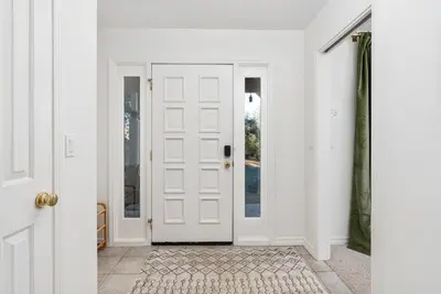 a white door in a room with a doorway at Lupine Landing in Mariposa