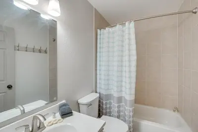 a bathroom with a sink and a toilet and a tub at Ski and Board in South Lake Tahoe! Updated Home in South Lake Tahoe
