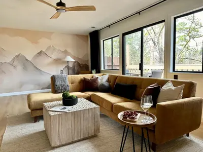 a living room with a couch and a table at Prime location Yosemite Adventure by Casa Oso in Oakhurst