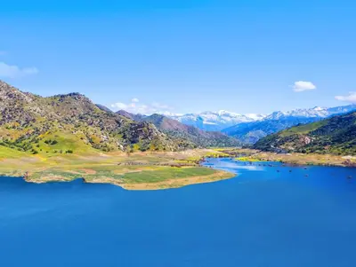 a view of a lake with mountains in the background at The Atwell Sequoia Motel RM 8 in Three Rivers