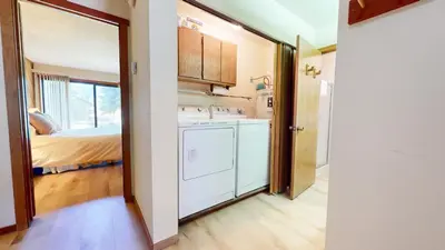a kitchen with a washer and dryer in a room at Snowcreek I #52 condo in Mammoth Lakes