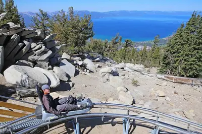 a man sitting on top of a roller coaster at Studio with Incredible Location in Tahoe City in Tahoe City