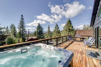 a jacuzzi tub on the deck of a house at Steps to Beach Family Home with Views in Tahoe City in Tahoe City