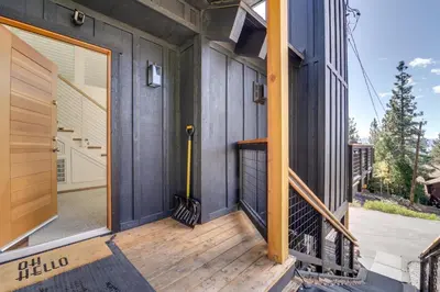 a front door of a house with a wooden porch at Steps to Beach Family Home with Views in Tahoe City in Tahoe City