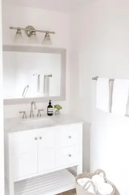 a white bathroom with a sink and a mirror at Oasis East Sac Charming Home with Saltwater Pool and Casita in Sacramento