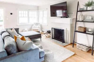 a living room with a couch and a fireplace at Oasis East Sac Charming Home with Saltwater Pool and Casita in Sacramento