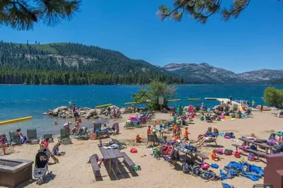 a group of people on the beach at a lake at 3BR Tahoe Donner Cabin with HOA Perks like Pools Hot-Tub Minutes to Trails Lake Golf in Truckee