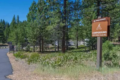 a sign for a campground next to a road at 3BR Tahoe Donner Cabin with HOA Perks like Pools Hot-Tub Minutes to Trails Lake Golf in Truckee
