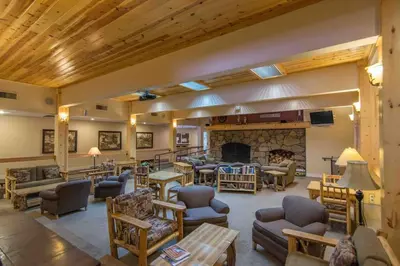 a living room filled with furniture and a fireplace at 3BR Tahoe Donner Cabin with HOA Perks like Pools Hot-Tub Minutes to Trails Lake Golf in Truckee