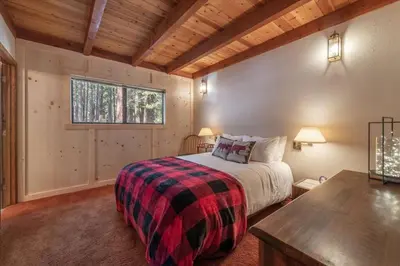 a bedroom with a bed and a window at 3BR Tahoe Donner Cabin with HOA Perks like Pools Hot-Tub Minutes to Trails Lake Golf in Truckee