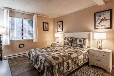 a bedroom with a bed and two lamps and a window at Summit Forester #47 BLDG.2 Bedrm / 2 bath Ski in Ski Out! Steps to Chair 15 at Little Eagle Lodge! in Mammoth Lakes