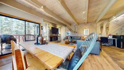 a dining room with a wooden table and chairs at Val D'Isere #8 condo in Mammoth Lakes