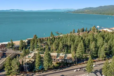 an aerial view of a town next to the water at Lakeland Village South Lake Tahoe in South Lake Tahoe