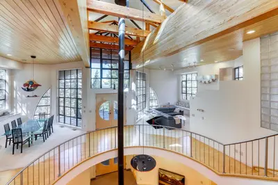 an open hallway with a staircase in a house at Remarkable Roundhouse Retreat in Truckee