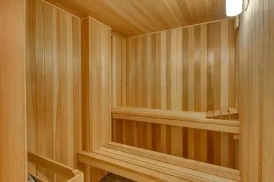a sauna with wood paneled walls and a wooden floor at Remarkable Roundhouse Retreat in Truckee