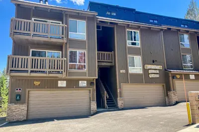 a large apartment building with two garage doors at Western Slopes Villas 3 in Mammoth Lakes