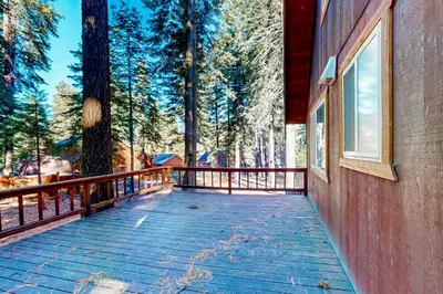 a wooden balcony of a house with trees at Tranquil Treehouse Haven in Tahoe City