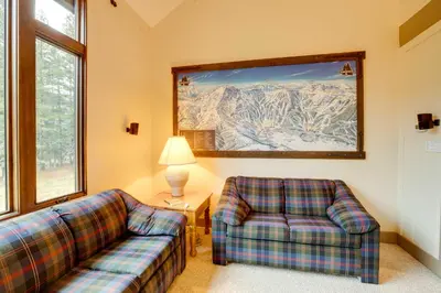 a living room with two couches and a painting on the wall at Mountain Condo with Fireplace in Kirkwood Ski Resort in Kirkwood