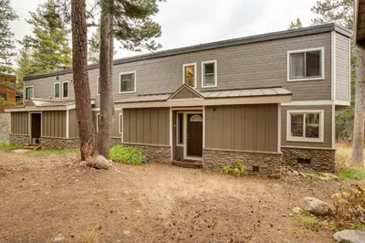 a house with a garage at Mountain Condo with Fireplace in Kirkwood Ski Resort in Kirkwood