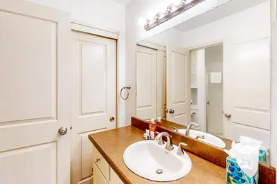 a bathroom with a sink and a mirror at Sierra Park Villas 11 C in Mammoth Lakes