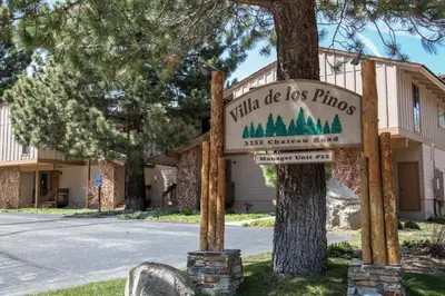 a sign for a little do less phono in front of a tree at Villa de los Pinos #40 condo in Mammoth Lakes