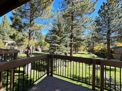 a view from the deck of a home with trees at Villa de los Pinos #40 condo in Mammoth Lakes