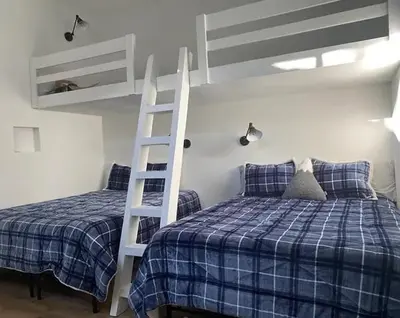 a bedroom with two bunk beds and a ladder at New Listing 2 bedroom +Loft 2 bath Summit E Bldg. #8 condo sleeps 8, Steps to Eagle Lodge/Chair #15 in Mammoth Lakes