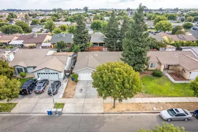 an aerial view of a residential neighborhood with houses at 3BR Cozy Home~ Stylish & New ~ UC Merced ~ en route Yosemite! in Merced
