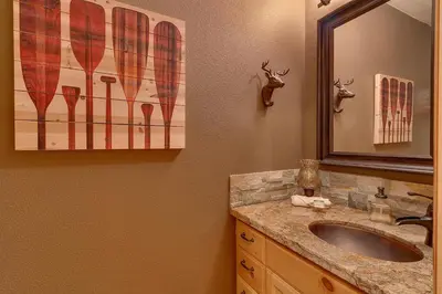 a bathroom with a sink and a mirror at Bear's Lair by Tahoe Getaways - 3 BR in Tahoe Donner with Hot Tub & Bonus Room! in Truckee