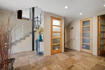 a hallway with a staircase and a door at Mountain Zen Tahoe Luxury Property Incline Village Lakeview in Incline Village