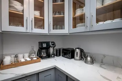 a kitchen counter with a coffee maker and a microwave at Entire Villa in Sierra Mountains in Alta