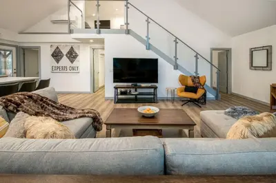 a living room with two couches and a tv at Entire Villa in Sierra Mountains in Alta