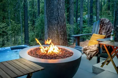 a fire pit in the middle of a patio at Entire Villa in Sierra Mountains in Alta
