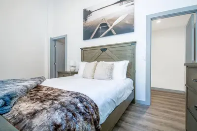 a bedroom with a large bed and a mirror at Luxury Villa in Sierra Mountains in Alta