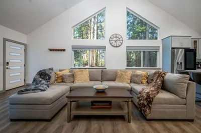 a living room with a couch and a table at Luxury Villa in Sierra Mountains in Alta