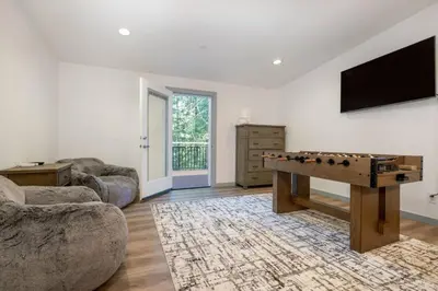 a living room with a ping pong table in it at Luxury Villa in Sierra Mountains in Alta