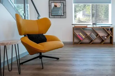 a yellow chair sitting in a room with a table at Luxury Villa in Sierra Mountains in Alta