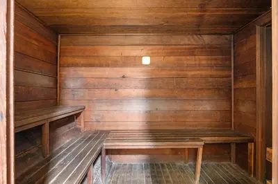 an empty sauna with wooden walls and wooden benches at Alpine Alcove: Tahoe Tranquility Near Kings Beach in Tahoe Vista
