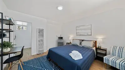 a bedroom with a bed and a desk and a chair at Adventure Lodge in South Lake Tahoe