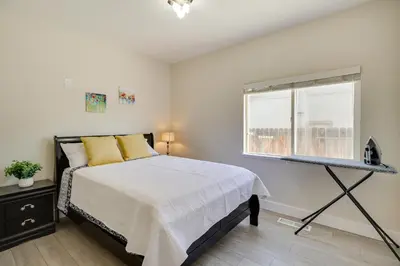 a bedroom with a bed and a window at 4 Mi to Downtown Reno Family Retreat with Fireplace in Reno