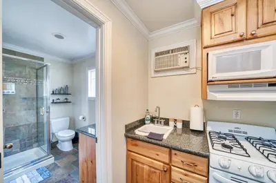 a kitchen with a sink and a stove top oven at Moose and Maple Lodge in South Lake Tahoe