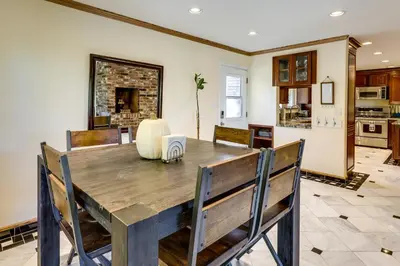 a kitchen and dining room with a table and chairs at Spacious Reno Vacation Rental about 3 Mi to MidTown! in Reno