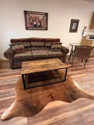 a living room with a couch and a coffee table at Wonky Donkey Den 30 mi to Yosemite Arch Entrance in Mariposa
