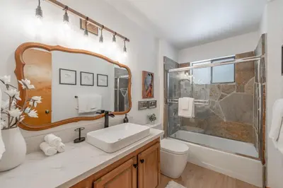 a bathroom with a sink and a shower at Camp Telemark by Tahoe Getaways - Pet-Friendly 3 BR in Tahoe Donner with Hot Tub & Wood Fireplace in Truckee