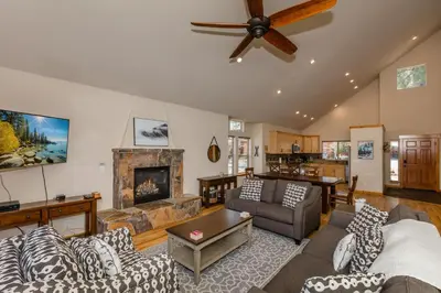 a living room with a couch and a fireplace at Cedar Crest at Winter Creek by Tahoe Getaways - 3BR, Walk to Ice Skating, Near Downtown and Northstar with Private Hot Tub! in Truckee