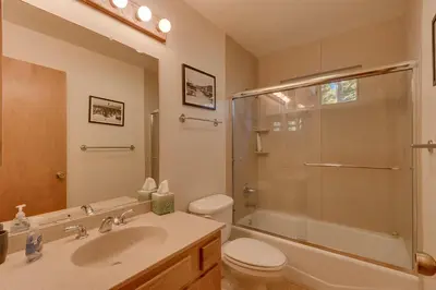 a bathroom with a sink and a toilet and a shower at Deer Hollow by Tahoe Getaways at Northstar - 4BR w Hot Tub, Ski Shuttle, & HOA Amenities in Truckee