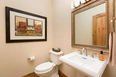 a bathroom with a white toilet and a sink at Caleb's Getaway by Tahoe Getaways at Old Greenwood- 3BR w Bonus Room, Pets Welcome & Ski Shuttle! in Truckee