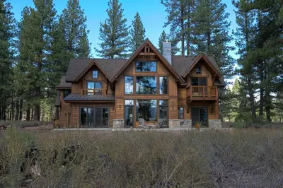 a large wooden house in the woods at Caleb's Getaway by Tahoe Getaways at Old Greenwood- 3BR w Bonus Room, Pets Welcome & Ski Shuttle! in Truckee