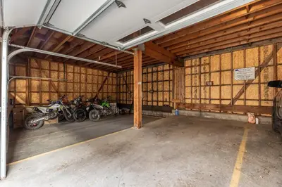a garage with two motorcycles parked in it at Epic Condo walk to Canyon Lodge in Mammoth Lakes
